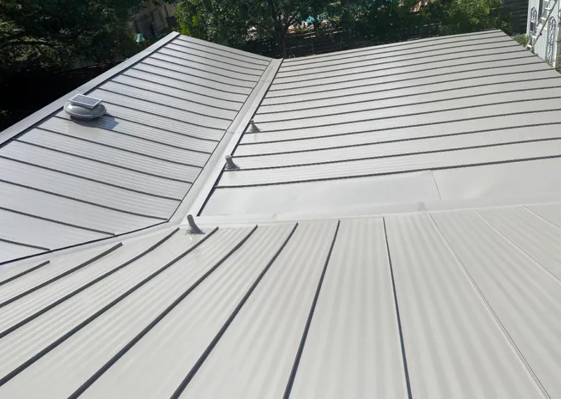 Solar attic fan installed on a metal roof for Roof Ventilation in Hot Springs Village